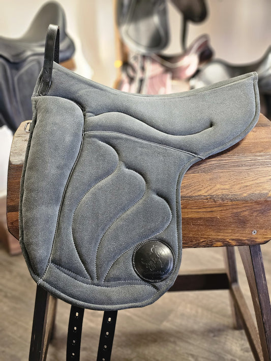 A gray bareback pad designed for horses, featuring a cutout for the horse's neck and equipped with straps for secure mounting.